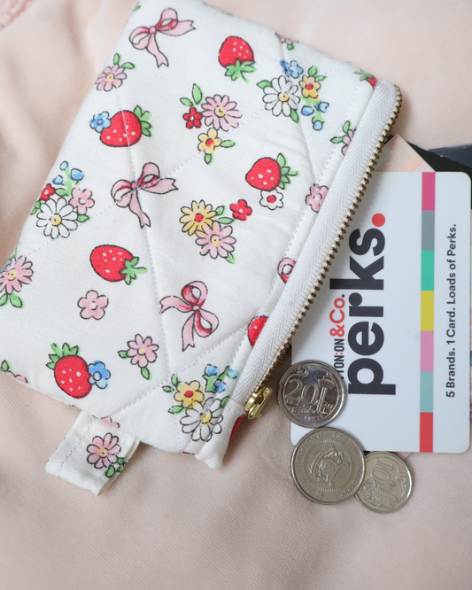 Floral-patterned pouch with coins 